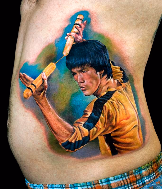 Bruce Lee color portrait tattoo