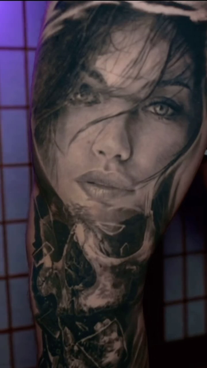 Black-and-grey woman portrait leg sleeve with skull