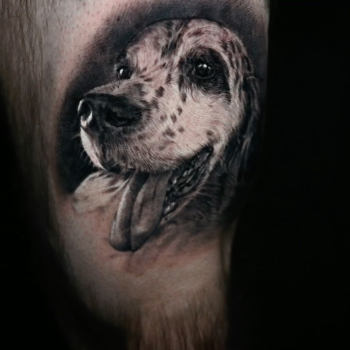 Black-and-grey dog portrait tattoo
