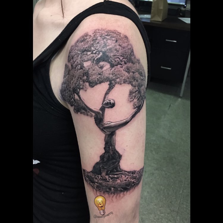 Black-and-grey tree of life tattoo, bicep