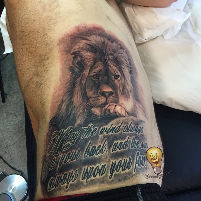 Black-and-grey lion portrait with script, ribs