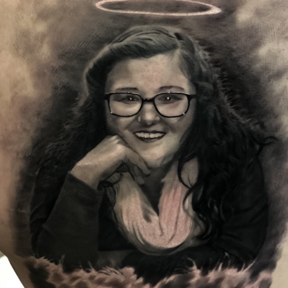 Black-and-grey memorial portrait with halo