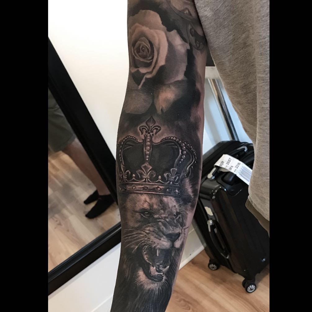 Black-and-grey lion and crown sleeve with rose