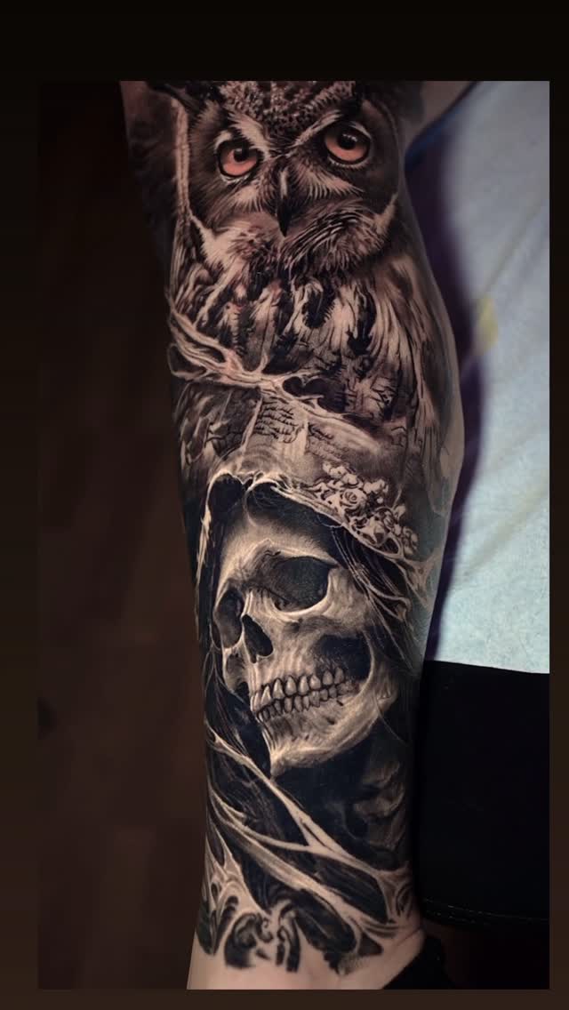 Black-and-grey owl and skull realism sleeve