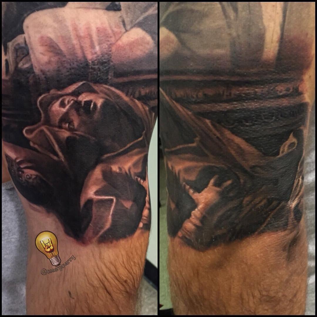 Black-and-grey religious portrait, thigh