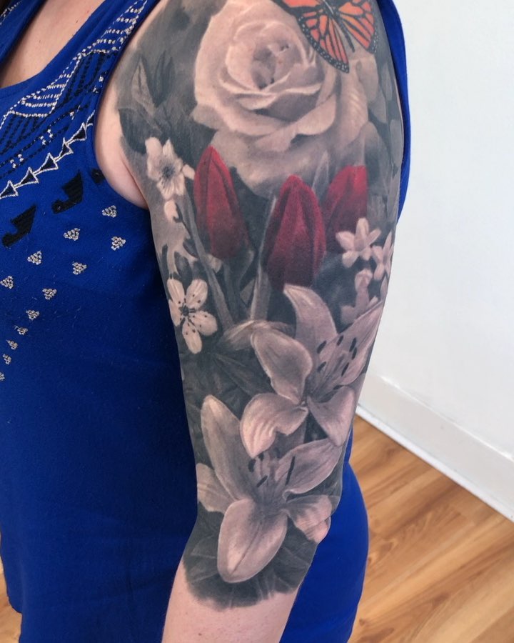 Black-and-grey floral half sleeve with butterfly