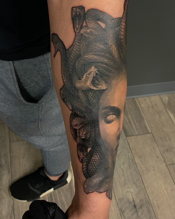 Black-and-grey Medusa realism, forearm