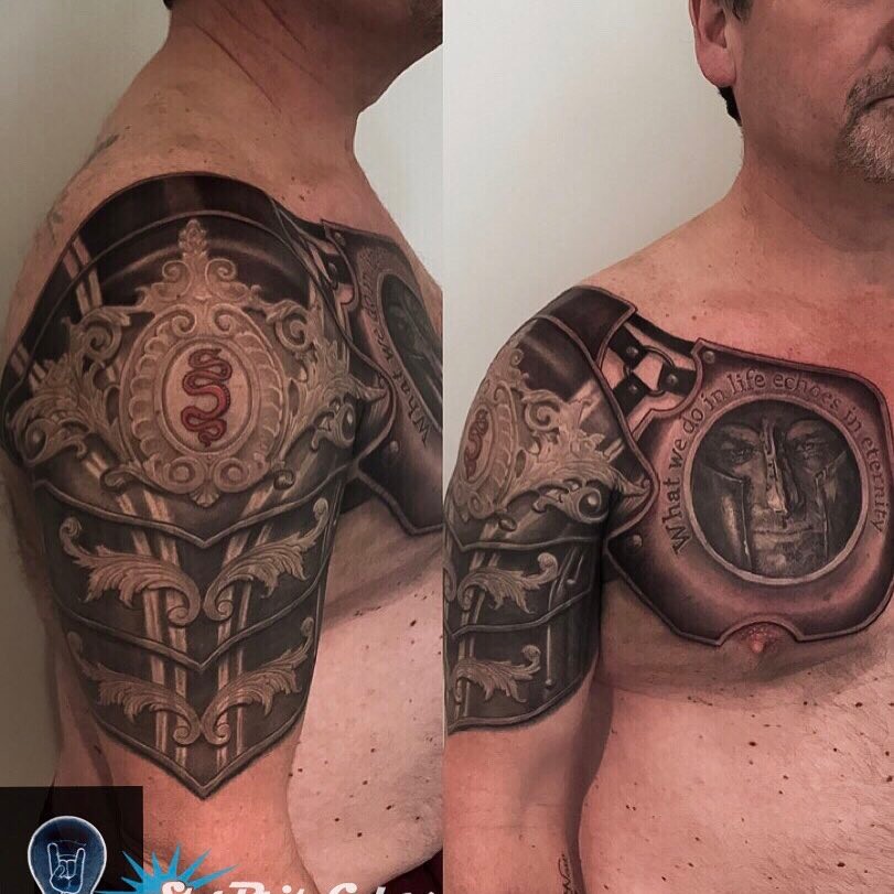 Black-and-grey armor tattoo, chest and shoulder