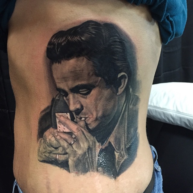 Johnny Cash portrait tattoo, ribs