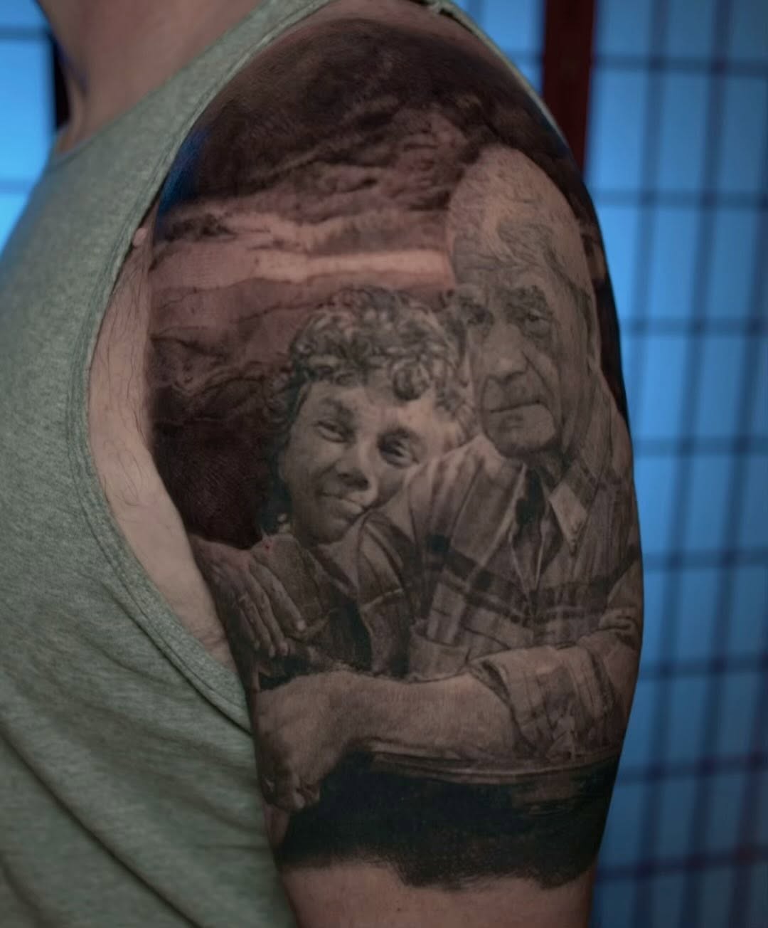 Black-and-grey family memorial portrait, upper arm