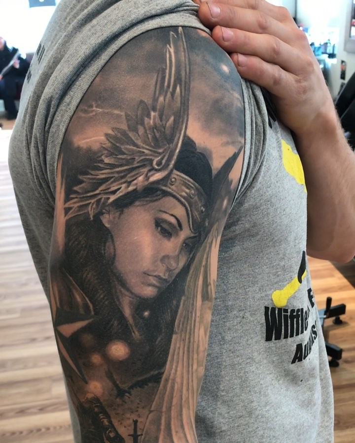 Black-and-grey Viking warrior portrait, bicep