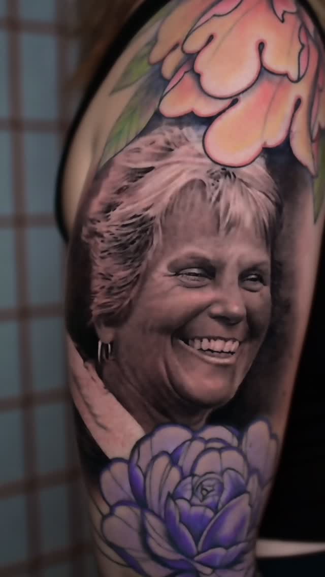Black-and-grey grandmother portrait with floral color