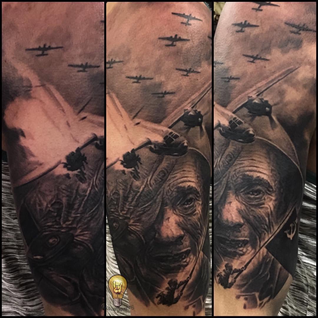 Black-and-grey WWII Russian war sleeve tattoo