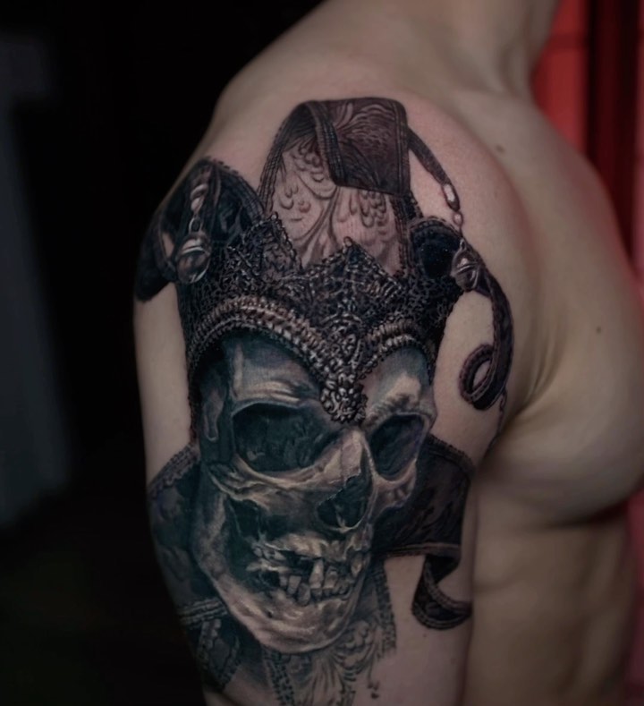 Skeleton jester skull tattoo, bicep