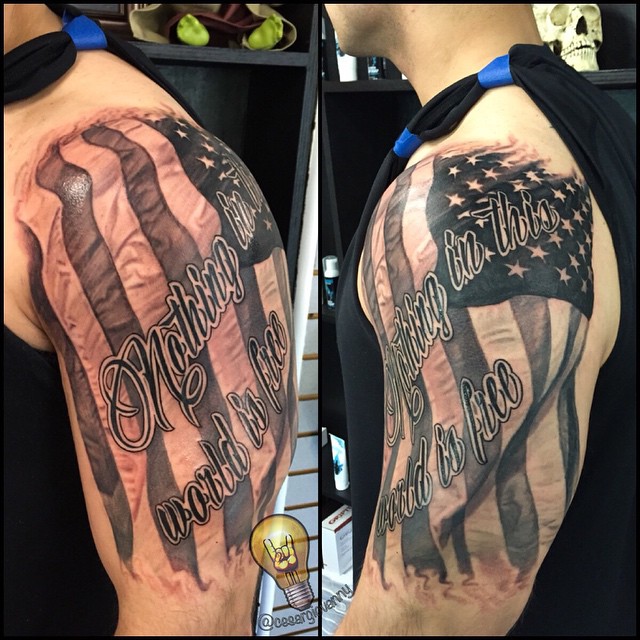 Black-and-grey American flag with script, bicep