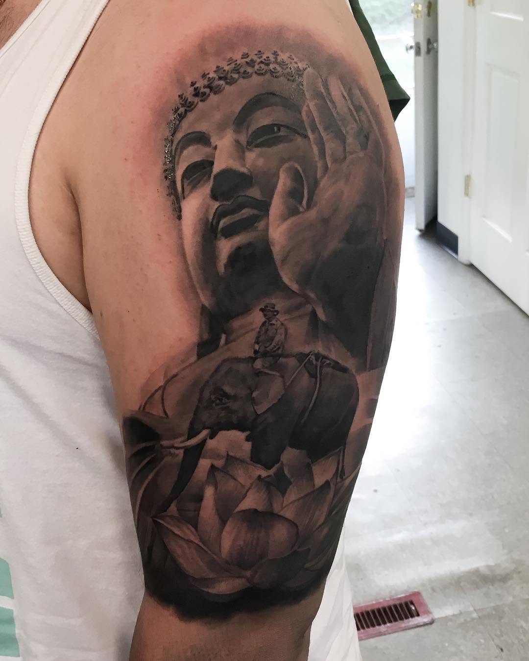 Black-and-grey Buddha and lotus half-sleeve