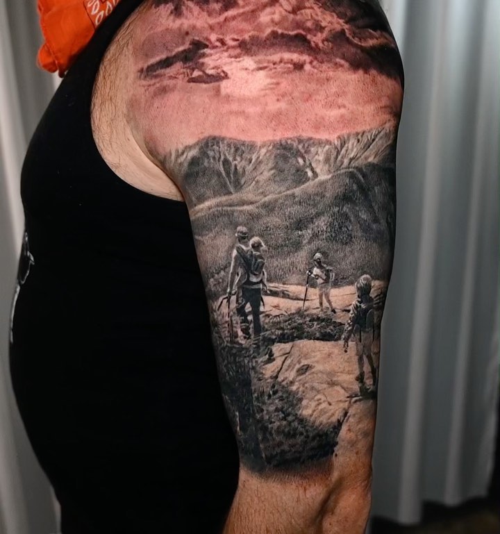 Black-and-grey hiking scene half-sleeve