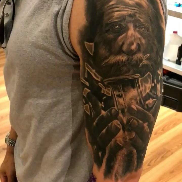 Black-and-grey bearded warrior portrait, half sleeve