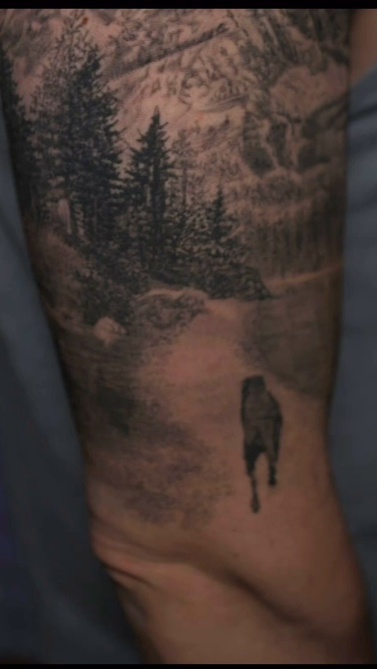 Black-and-grey forest path memorial tattoo, arm