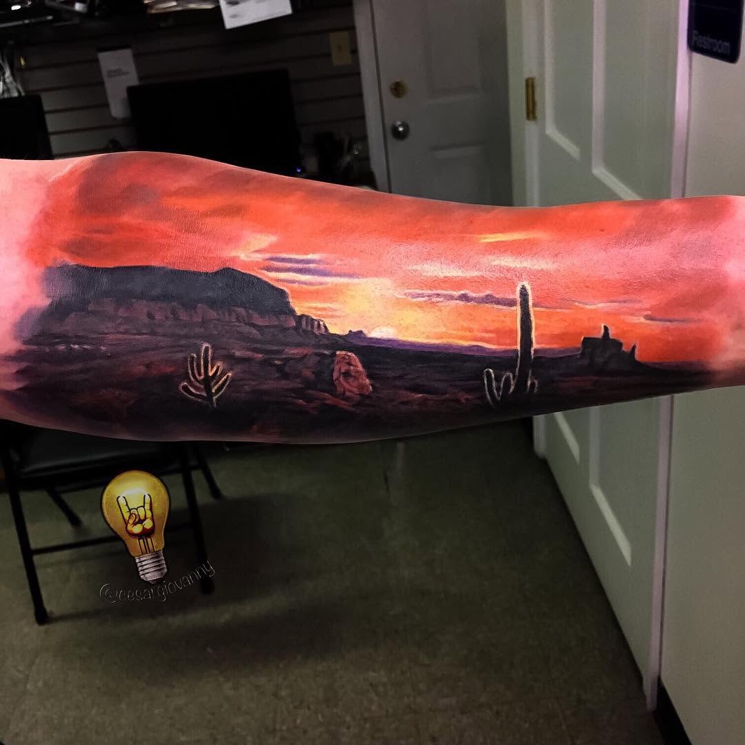 Color desert sunset landscape tattoo, forearm