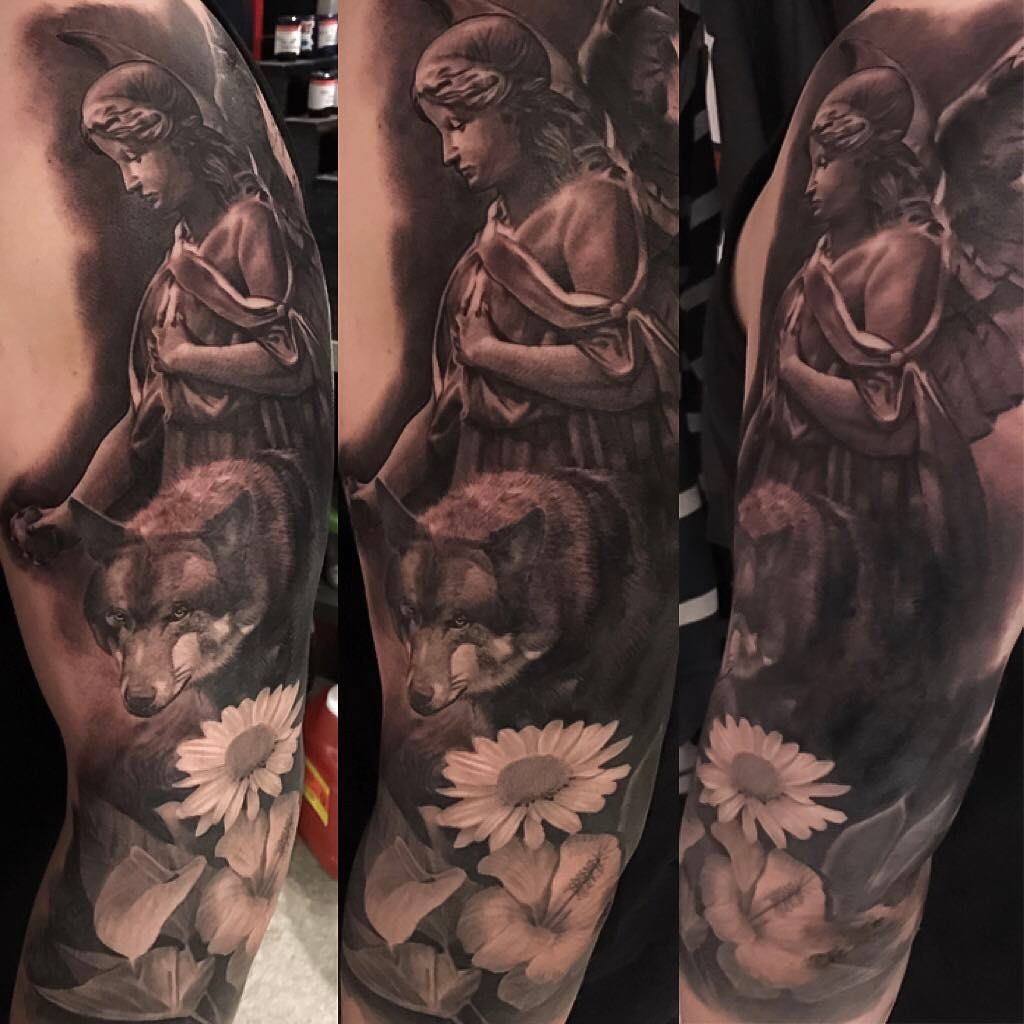 Black-and-grey angel, wolf and floral sleeve