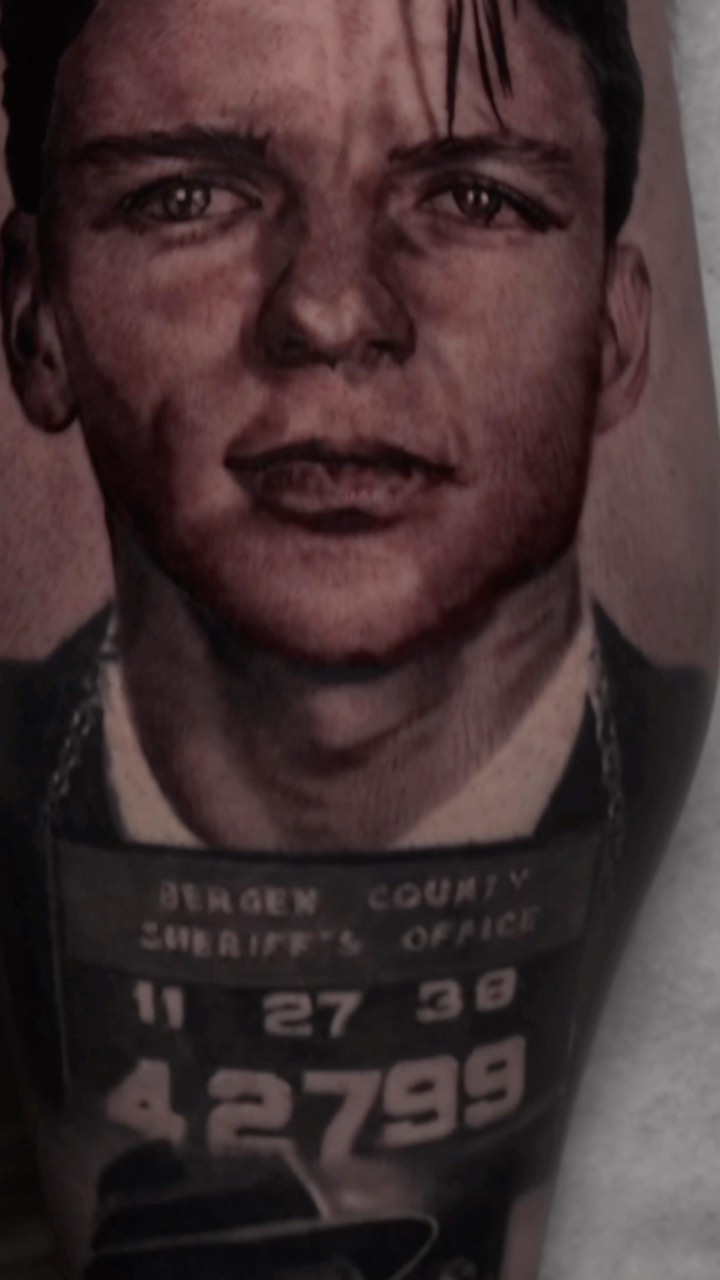 Frank Sinatra mugshot portrait tattoo, black and grey