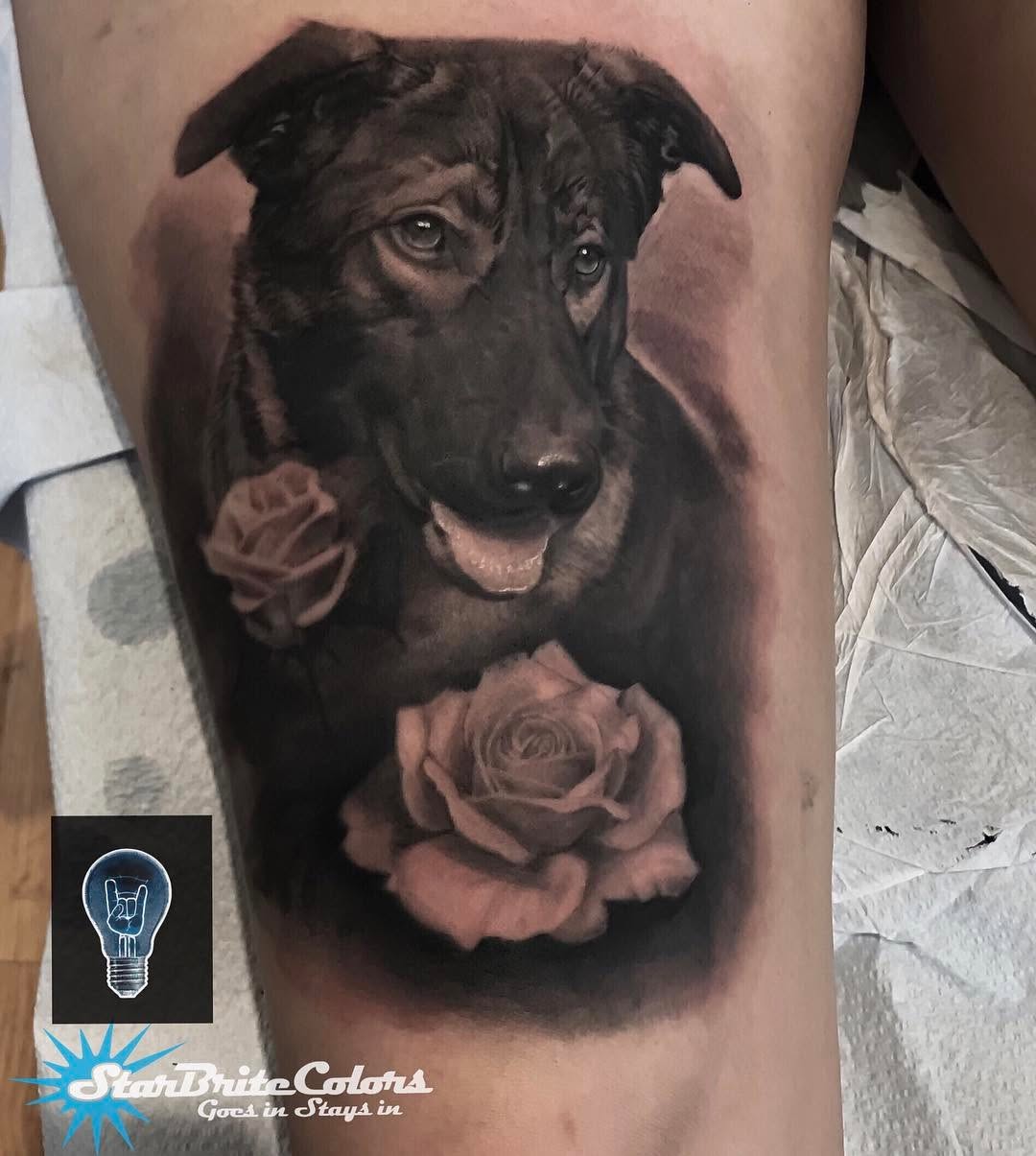 Black-and-grey dog portrait with roses, thigh