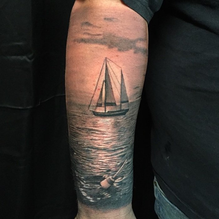 Black-and-grey sailboat seascape, forearm
