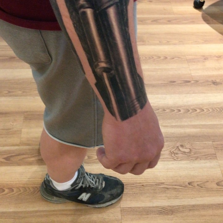 Black-and-grey mechanical arm sleeve tattoo