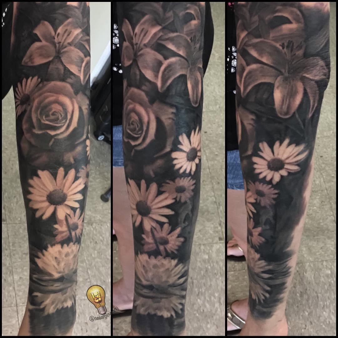 Black-and-grey floral leg sleeve with roses and lilies