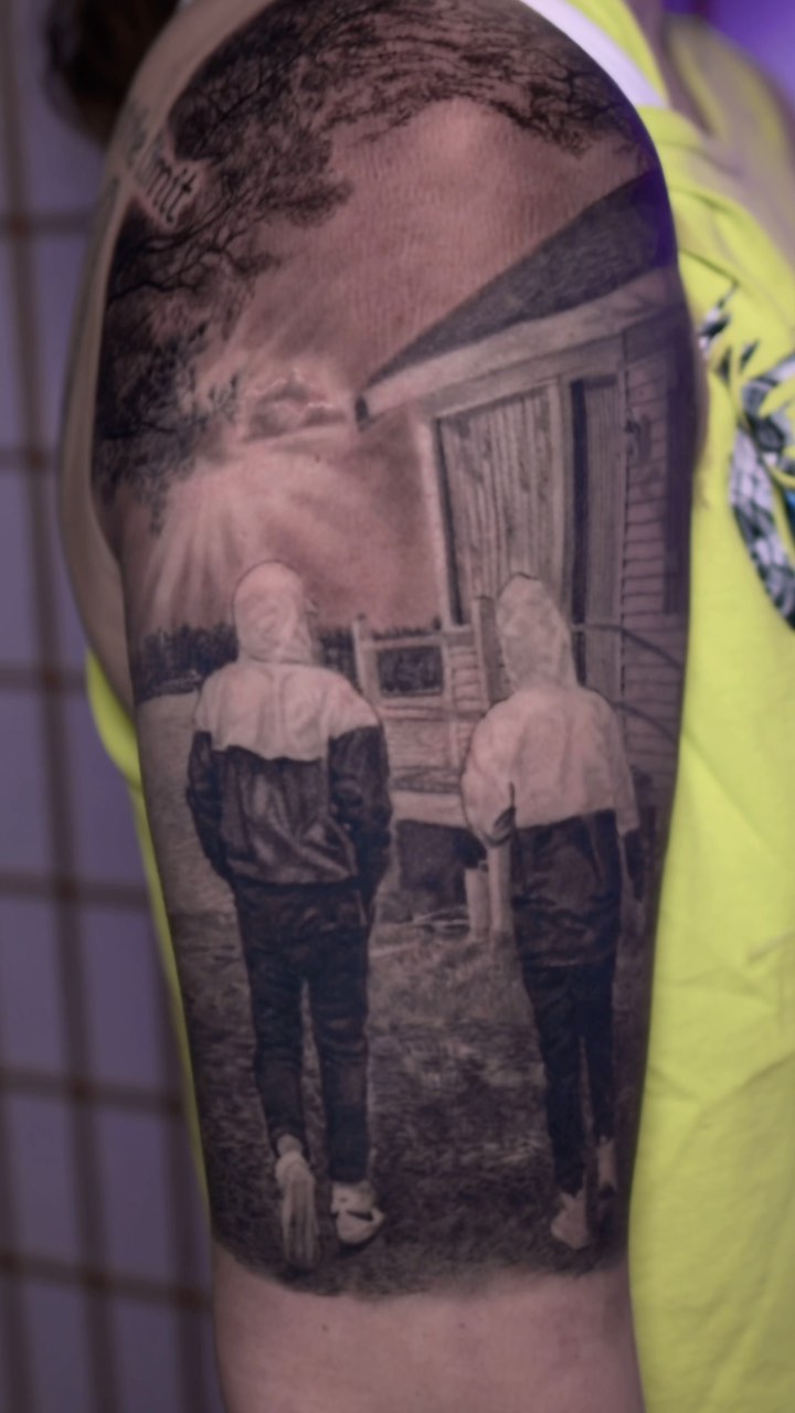 Black-and-grey memorial portrait sleeve, two friends