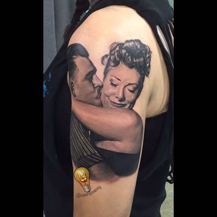 Black-and-grey couple portrait tattoo, shoulder