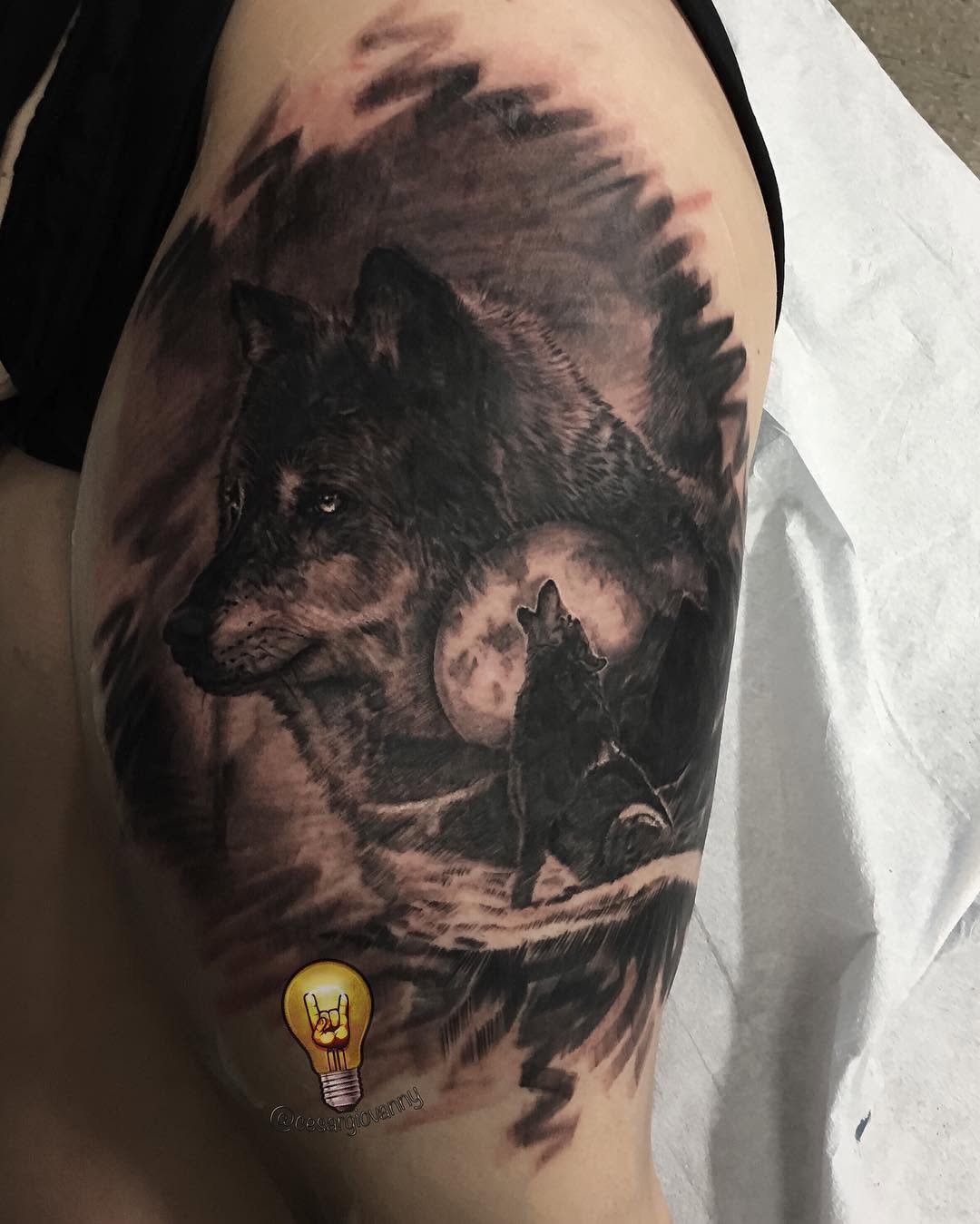 Black-and-grey wolf and moon tattoo, thigh