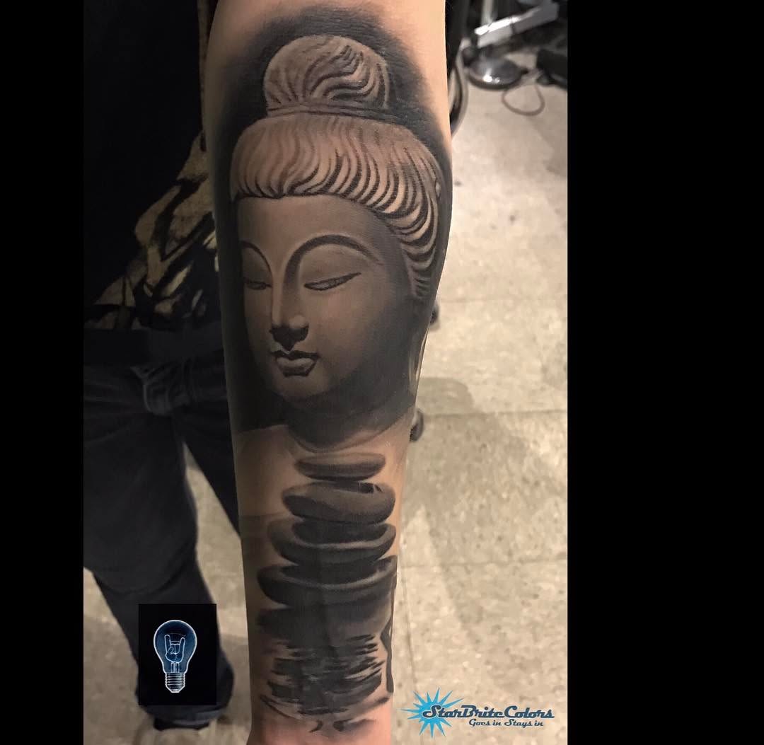 Black-and-grey Buddha tattoo, forearm