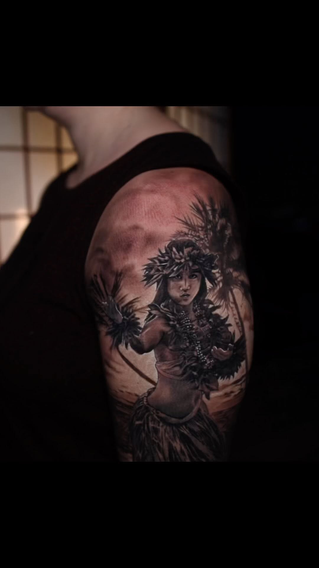 Black-and-grey hula girl portrait, bicep