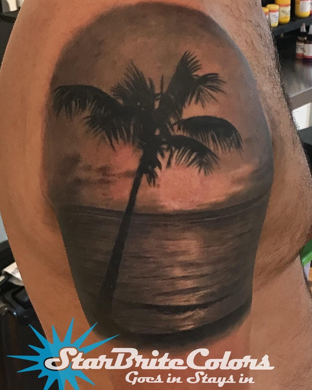 Black-and-grey palm tree beach sunset, shoulder
