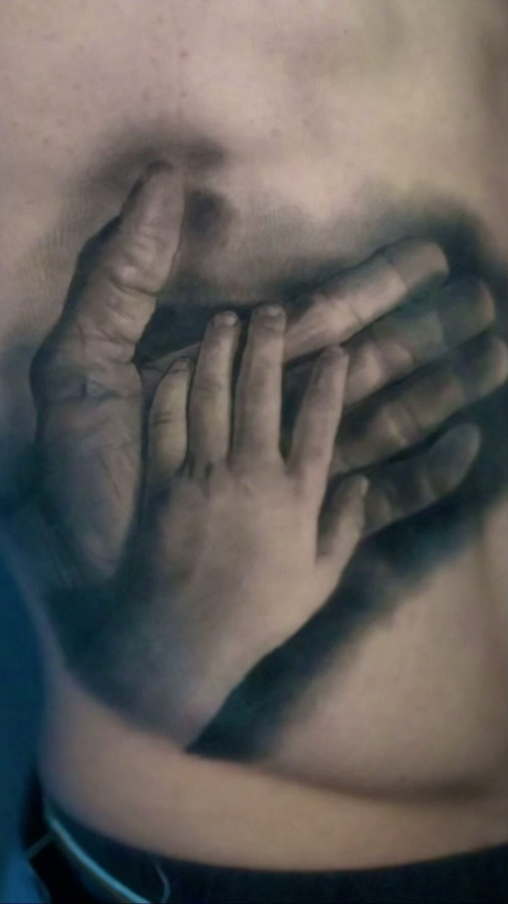 Black-and-grey realism hands tattoo, stomach