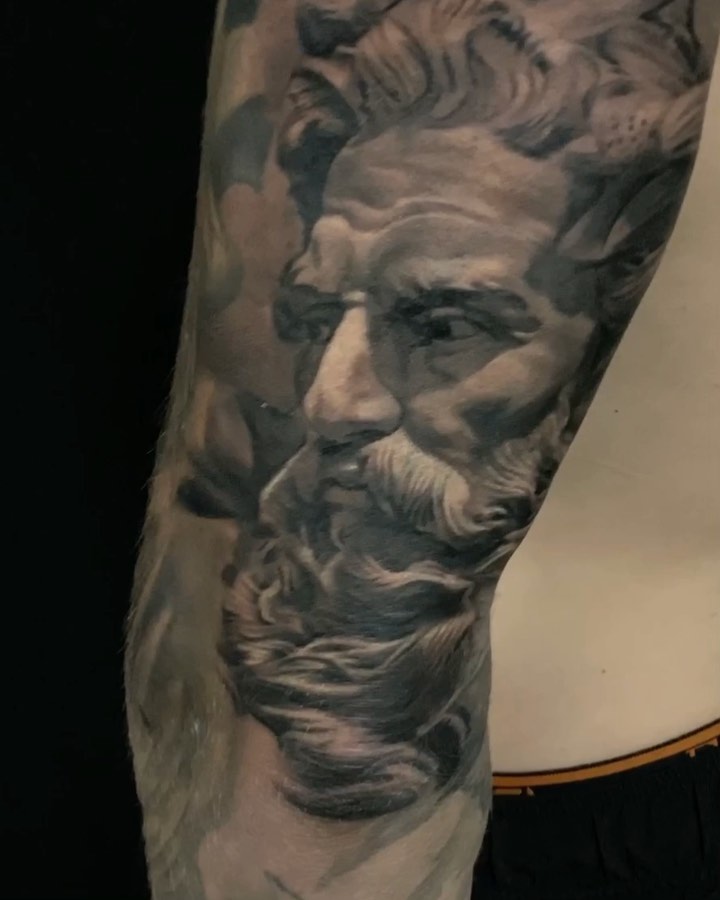 Black-and-grey statue portrait, forearm