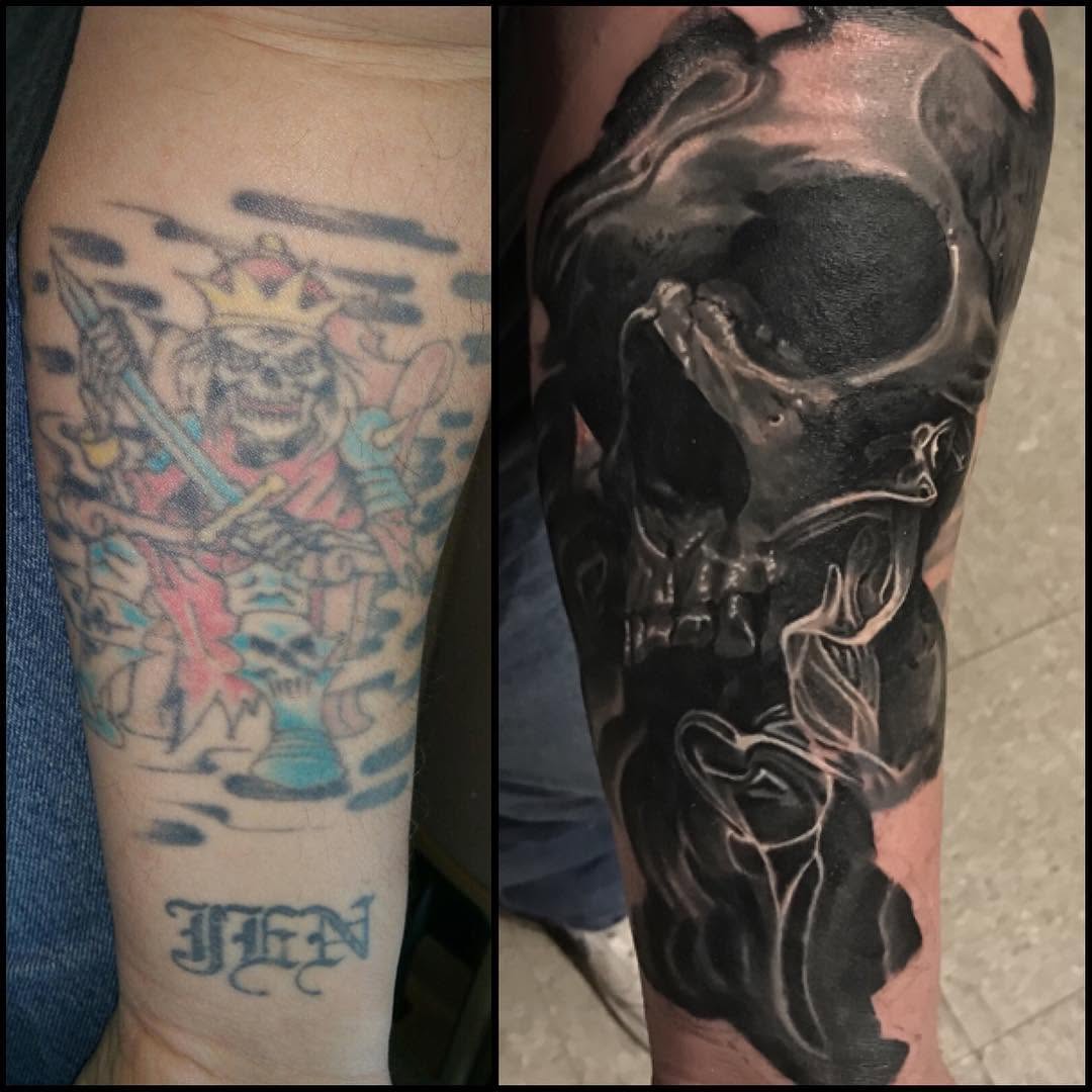 Black-and-grey skull cover-up tattoo, forearm