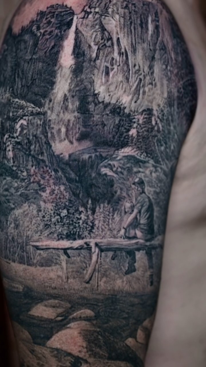 Black-and-grey landscape memorial sleeve, arm