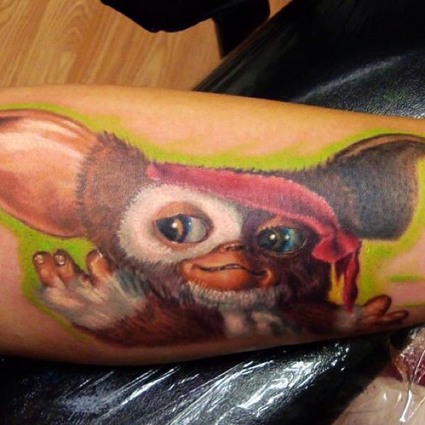 Color realism Gizmo Gremlins tattoo on arm