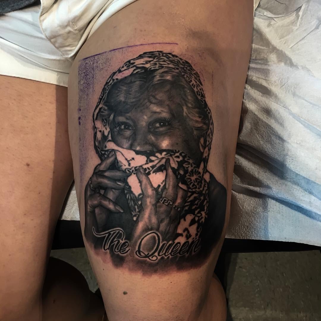 Black-and-grey grandmother portrait on thigh