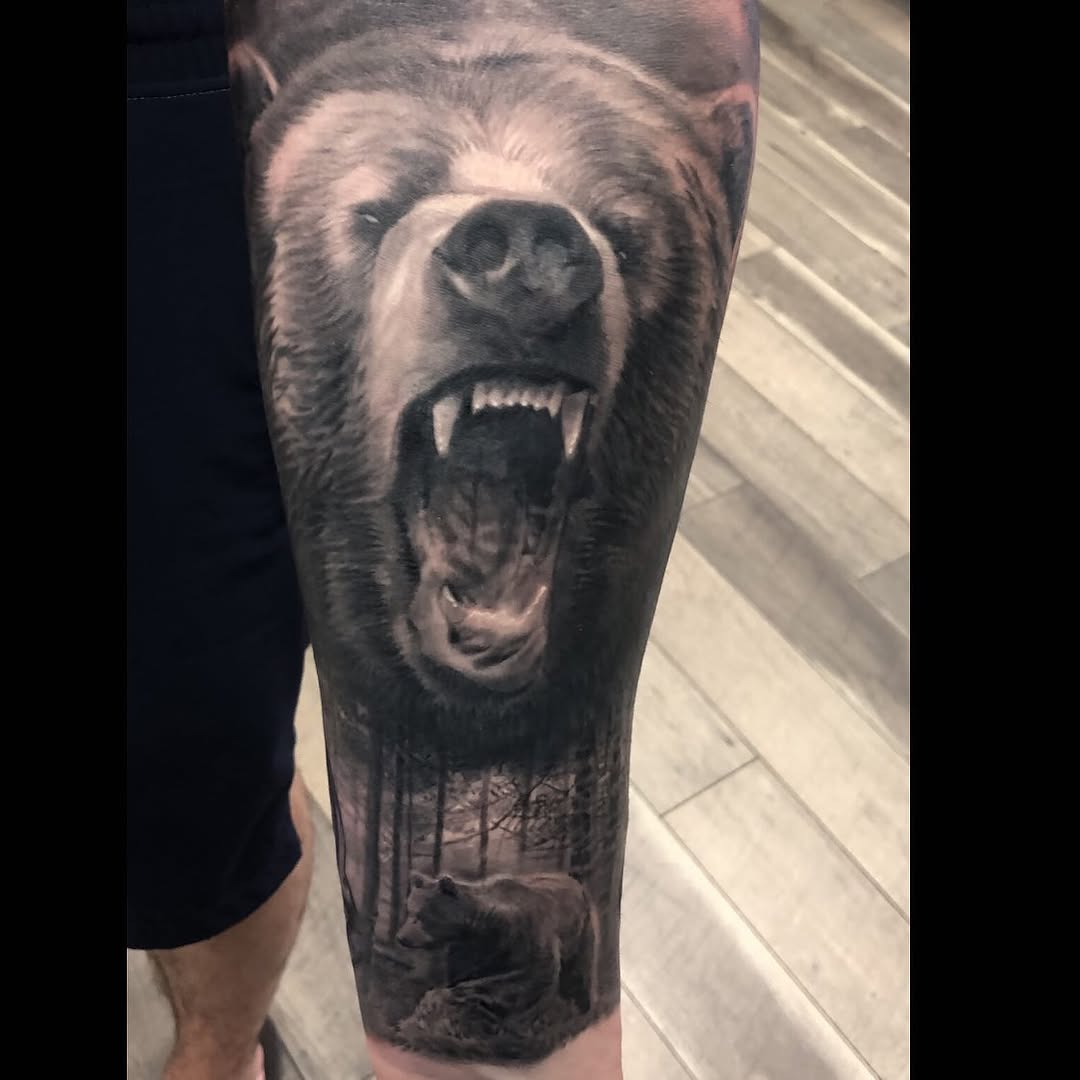 Black-and-grey roaring bear tattoo, leg sleeve