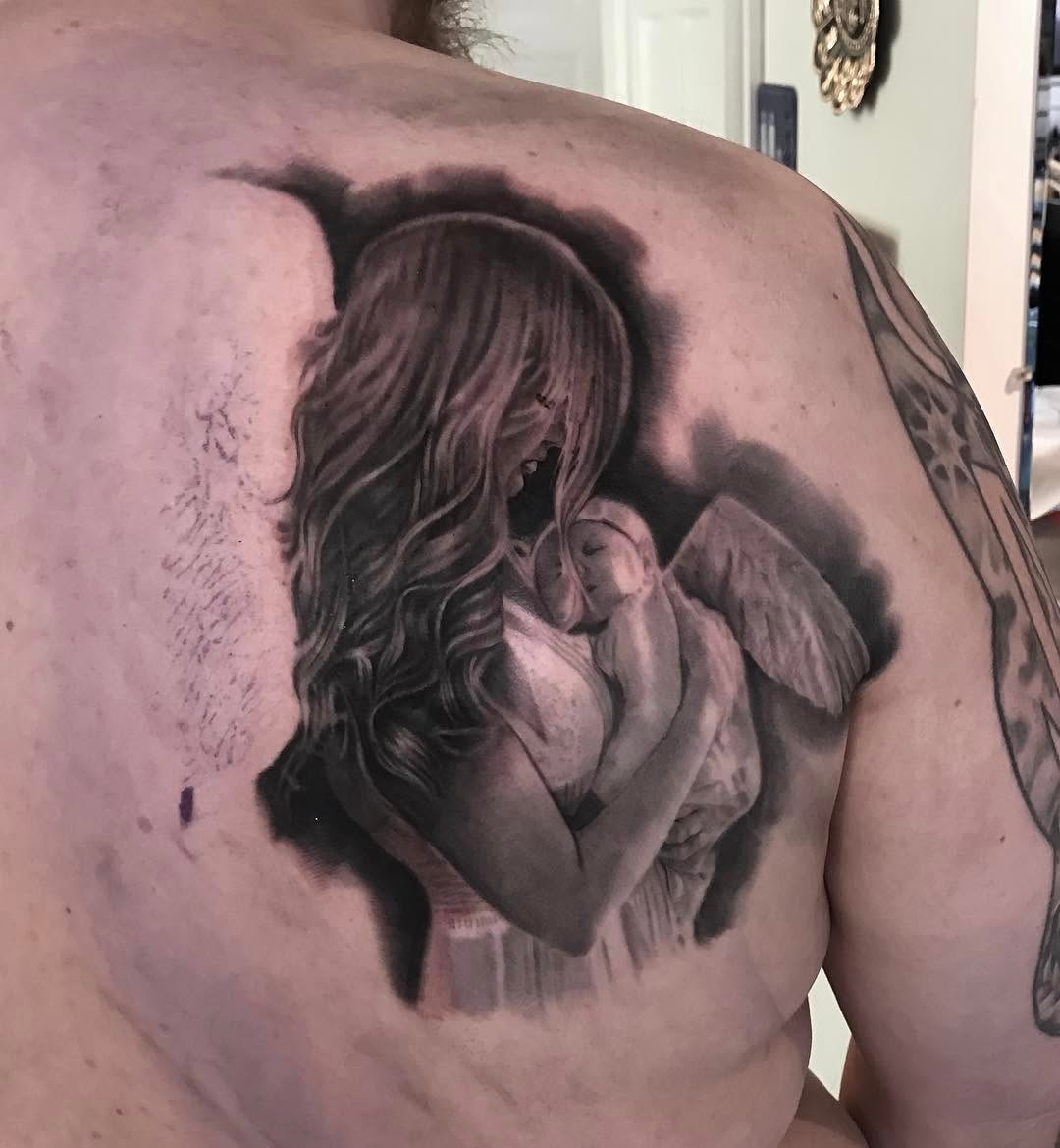 Black-and-grey mother and angel baby, back