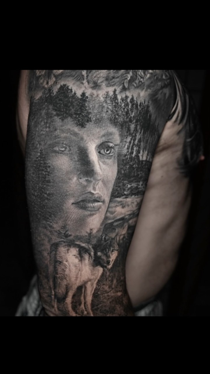 Black-and-grey portrait sleeve with wolf and forest