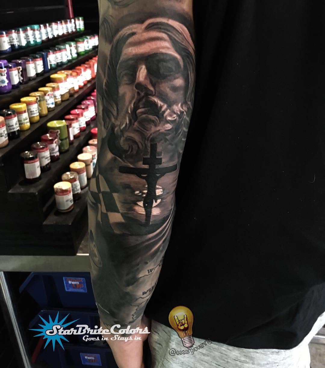 Black-and-grey Jesus and crucifix sleeve