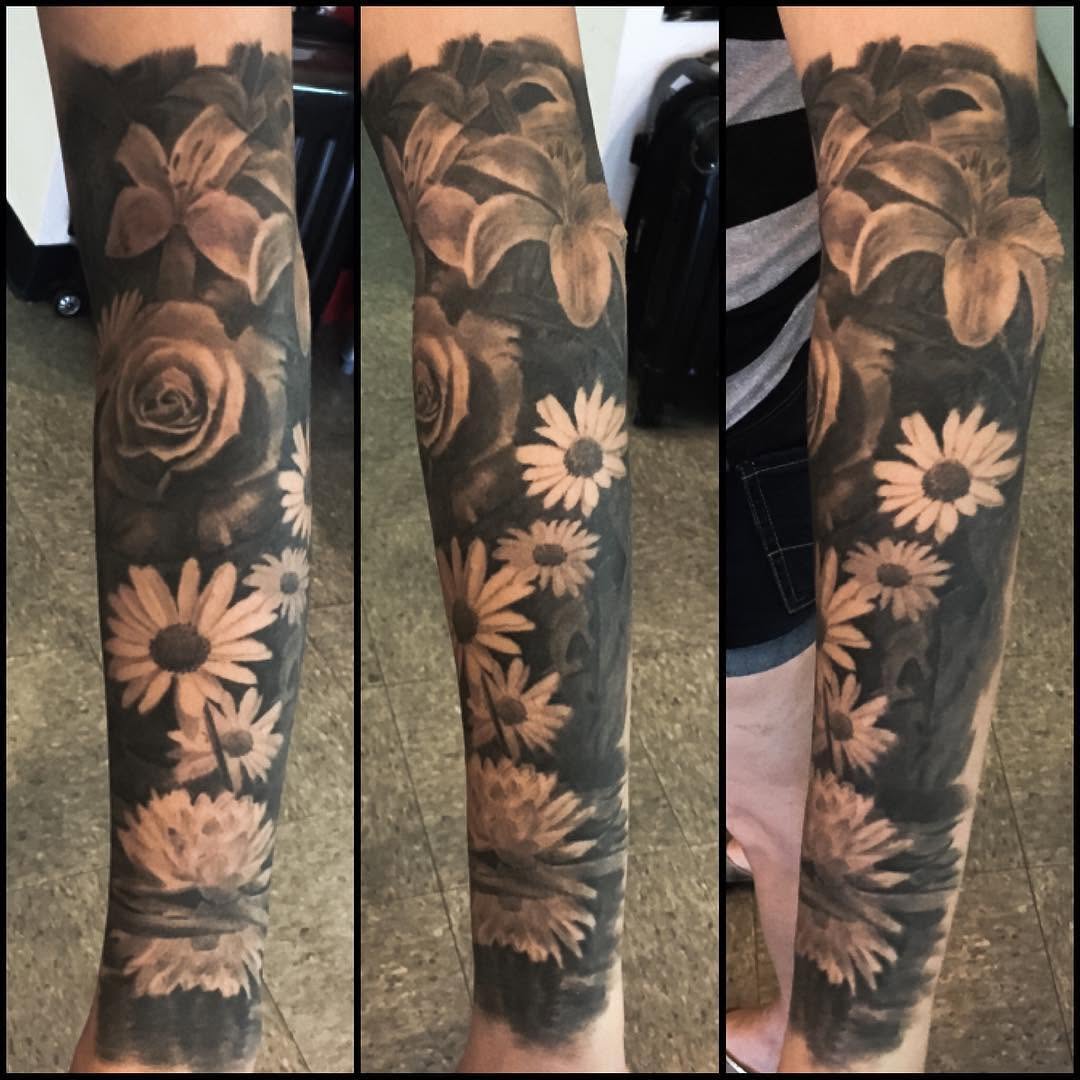 Black-and-grey floral half-sleeve, forearm
