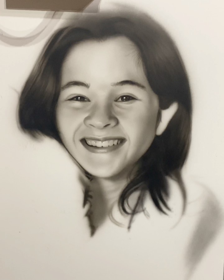 Black-and-white airbrush portrait of artist's daughter