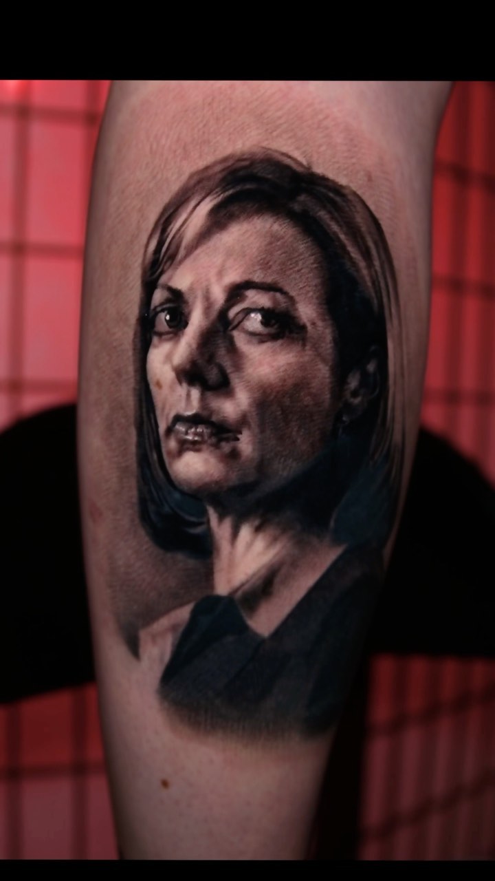 Black-and-grey C.J. Cregg portrait tattoo