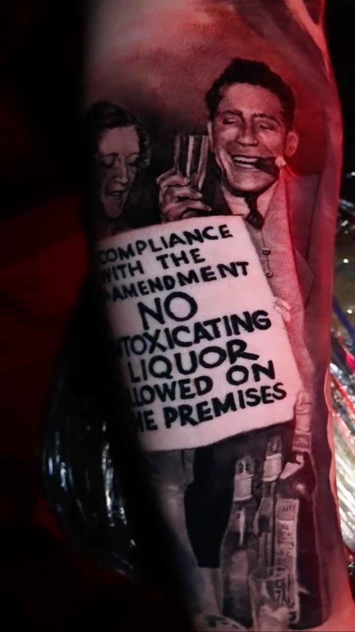 Prohibition-era black-and-grey tattoo, forearm